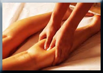Deep massage applied to female calf muscle