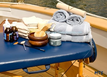 Massage therapy supplies displayed on a massage table.